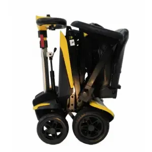 Automatic folding Transformer mobility scooter with lightweight design and spacious seat in folded position.