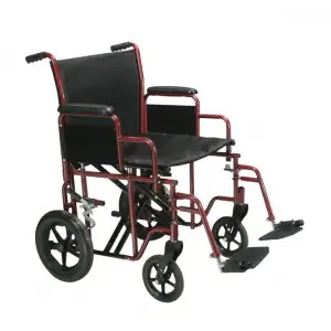 XL bariatric transport chair being pushed along a beachfront walkway in Hawaii, designed for assisted mobility and higher weight capacity.