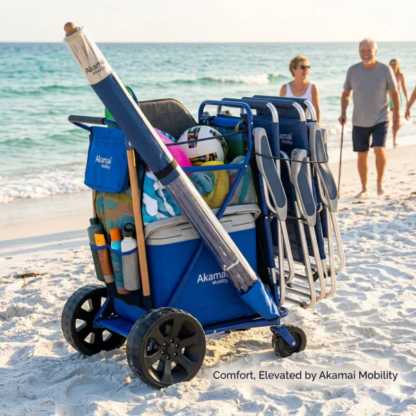 Blue heavy-duty beach cargo cart loaded with two tall-seated aluminum beach chairs and a large umbrella on a sunny Maui beach with the ocean in the background.